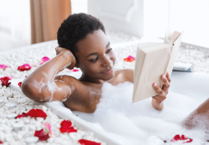 woman in bubble bath reading