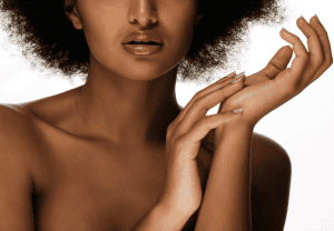 woman with healthy skin touching hands