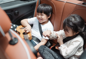 Kids playing in car traveling