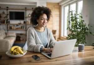 woman blogging on laptop